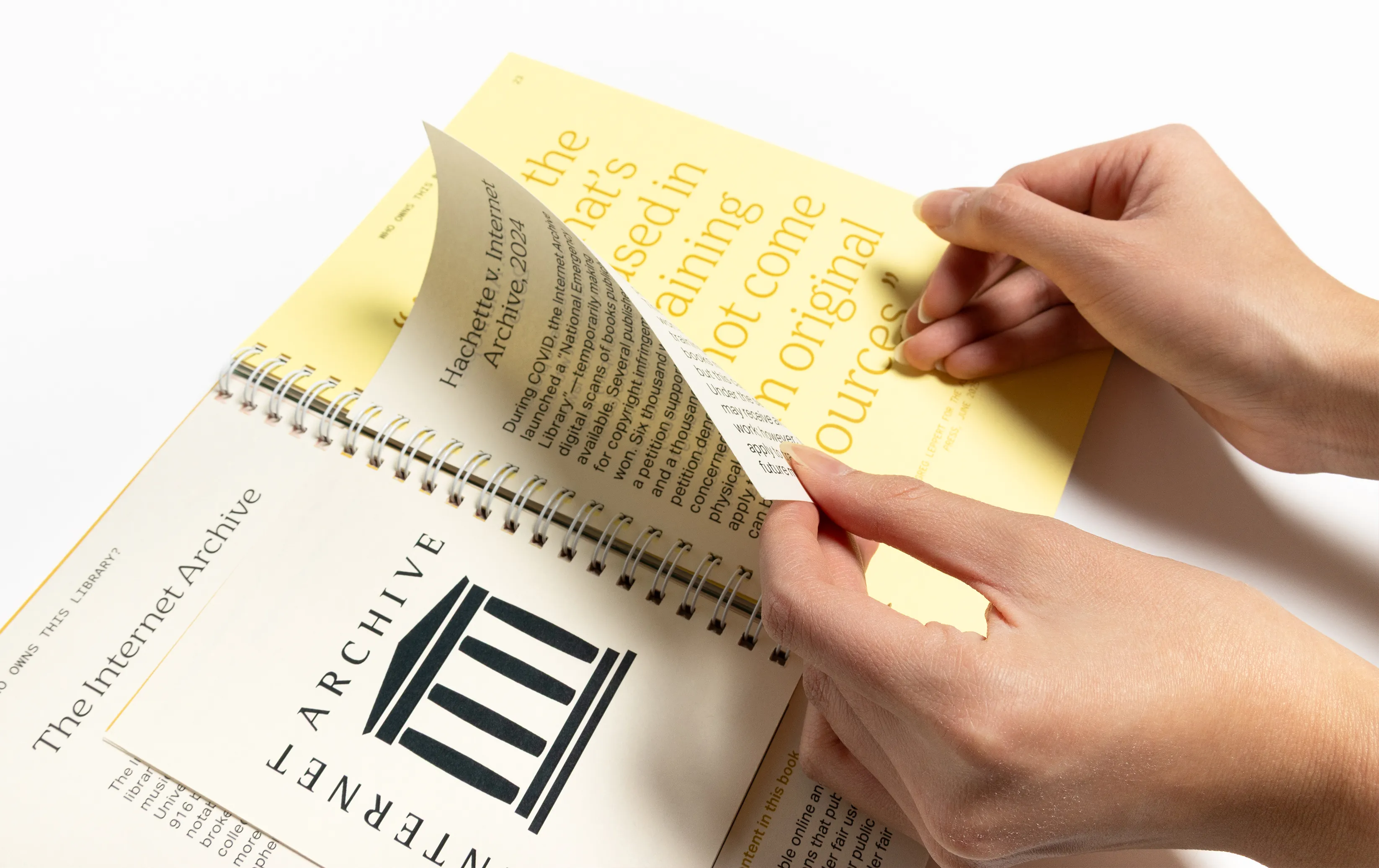 Yellow Open Book with Hands